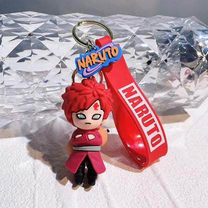 Red silicone naruto pvc keychain featuring chibi naruto with spiky red hair and green eyes in pink jacket and black pants