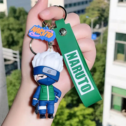 Blue and green naruto pvc silicone keychain with white hair blue mask and green strap featuring naruto text
