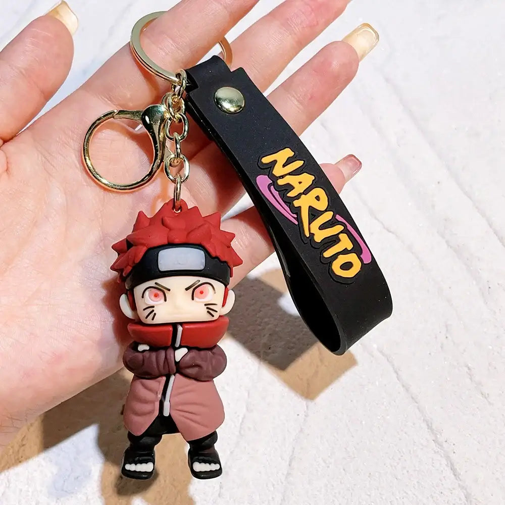 Red-haired Naruto pvc silicone keychain with black strap and gold hardware for anime fans and collectors