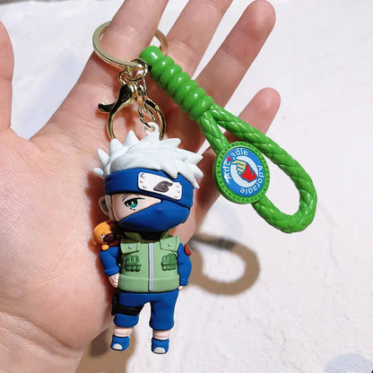 A green braided pvc silicone keychain featuring a detailed kakashi hatake figurine from naruto with white hair and blue mask