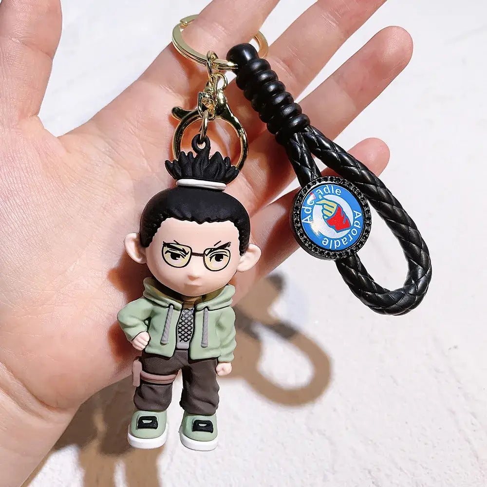 Naruto pvc silicone keychain with a black braided leather strap and green brown cartoon character charm