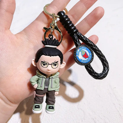 Naruto pvc silicone keychain with a black braided leather strap and green brown cartoon character charm