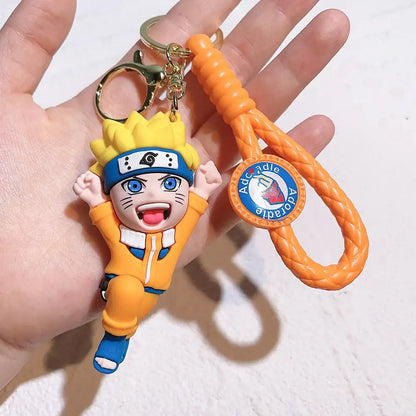 Orange braided pvc silicone keychain featuring a naruto figurine charm and an aocadle logo tag