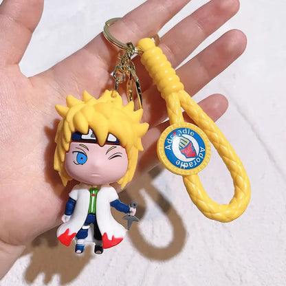 Yellow braided pvc silicone keychain featuring chibi naruto with spiky blonde hair and white coat over blue pants
