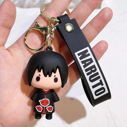 Black rubber naruto pvc silicone keychain with chibi character in red akatsuki cloak and white cloud patterns