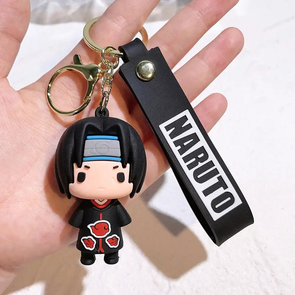 Black rubber pvc silicone keychain featuring chibi itachi uchiha from naruto with akatsuki cloak and blue headband