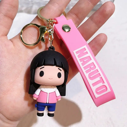 Pink naruto pvc silicone keychain with chibi black hair character in pink jacket and blue shorts rubber figure