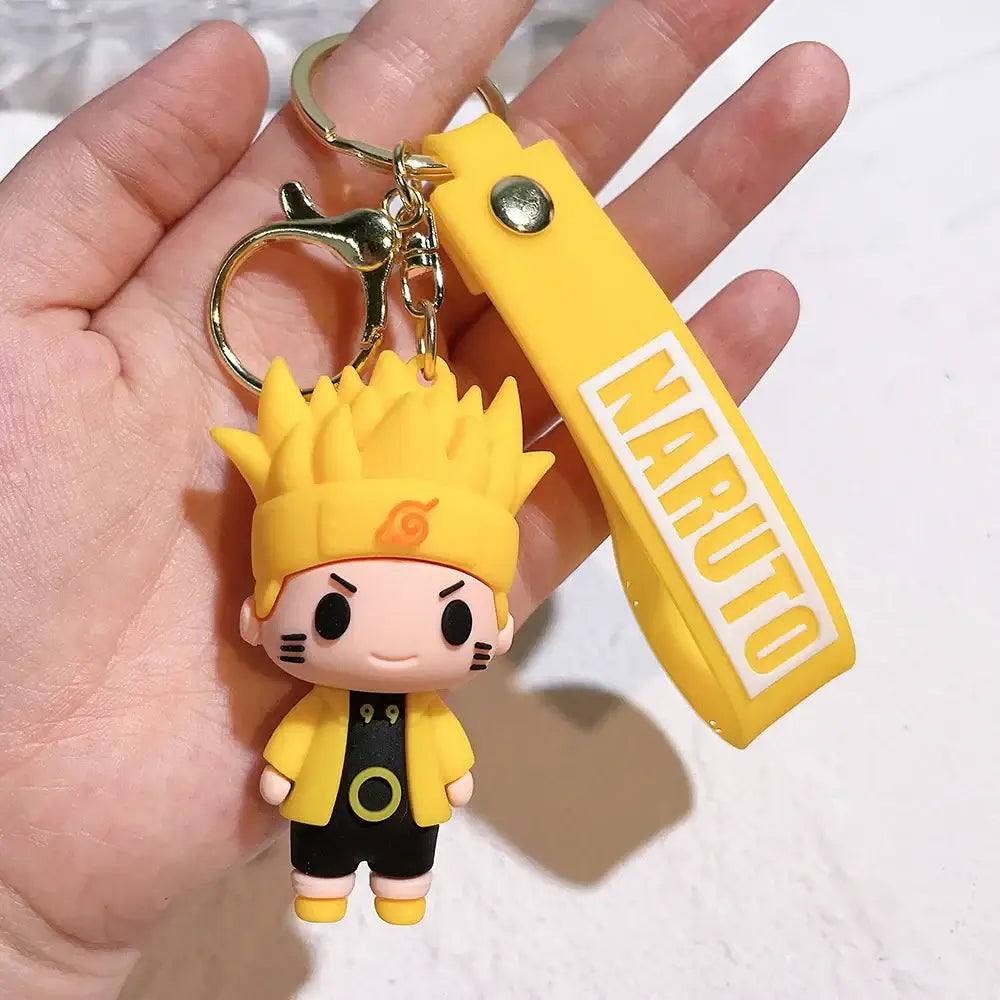 Yellow naruto pvc silicone keychain with matching yellow strap featuring white naruto lettering
