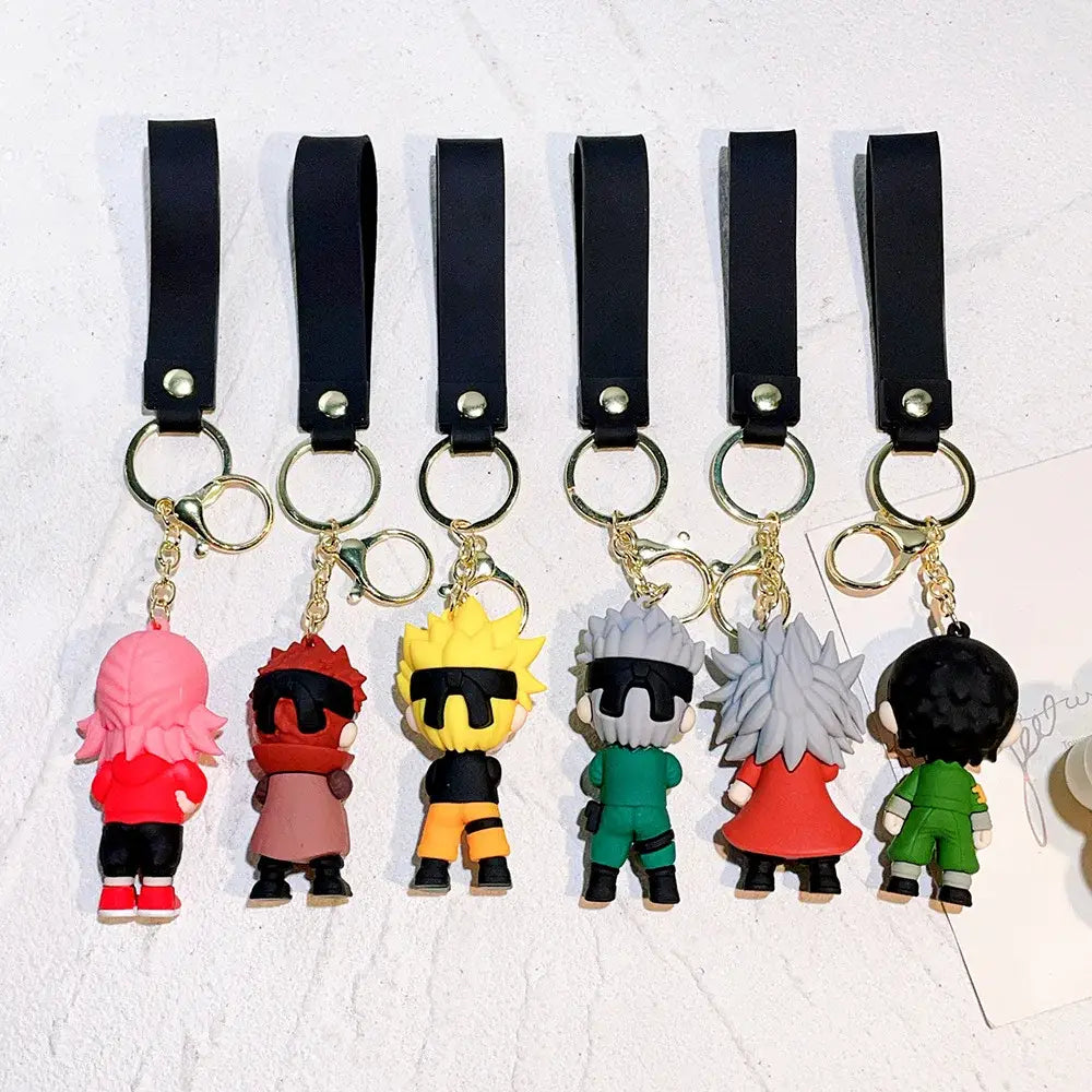 Six colorful naruto pvc silicone keychains with vibrant hair and outfits attached to black leather straps