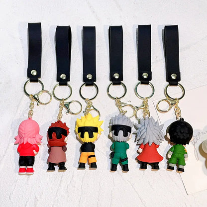Six colorful naruto pvc silicone keychains with vibrant hair and outfits attached to black leather straps