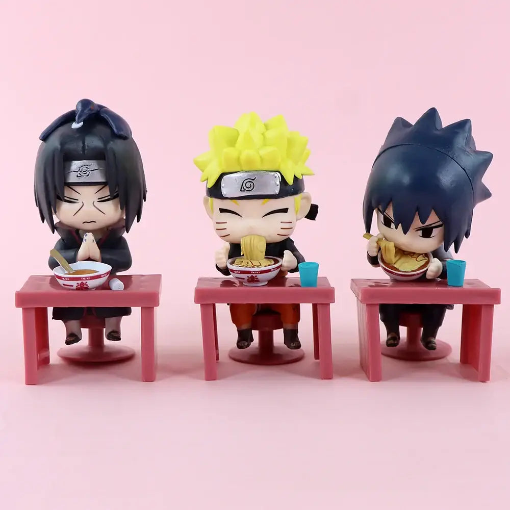 Three chibi style naruto and sasuke blind box figures seated at pink table with ramen for desk display