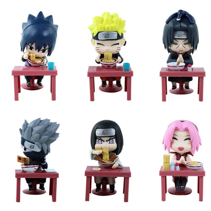 Chibi-style naruto and sasuke figurines with vibrant hair seated at miniature red tables from blind box set