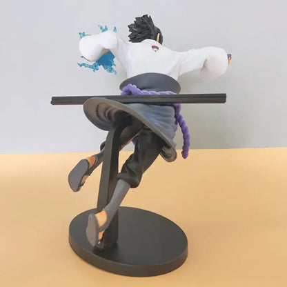 Naruto sasuke pvc statue of black-haired anime figure in dynamic pose with white top and purple sash on black base