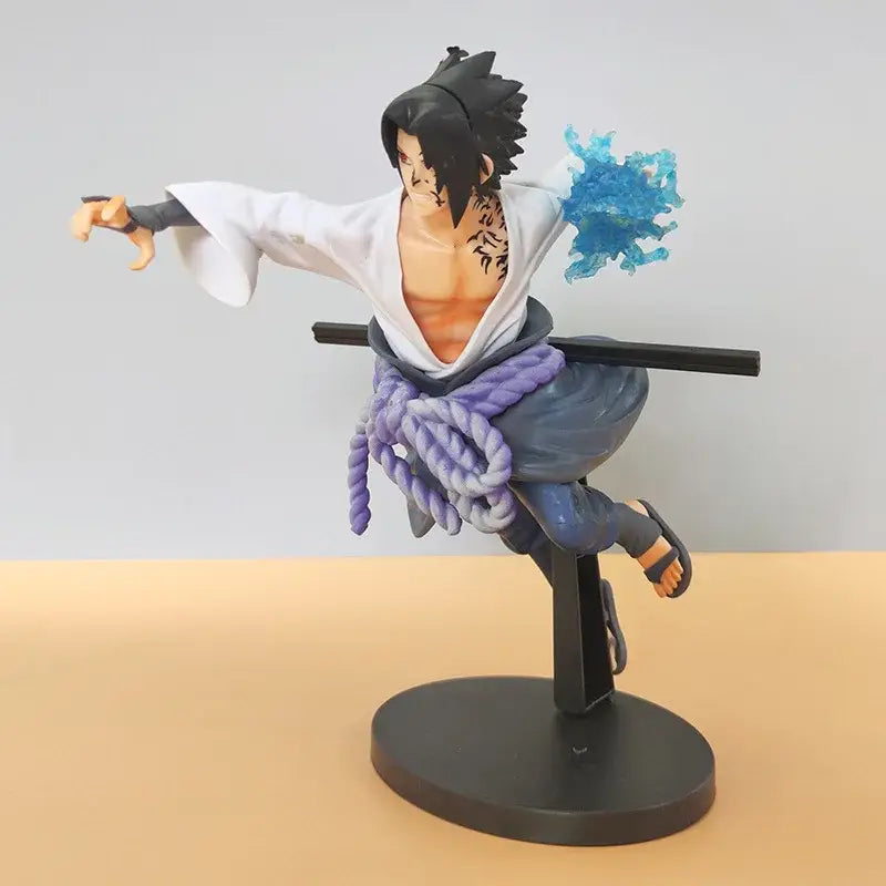 Naruto sasuke pvc statue showing black-haired figure in white robe with blue rope sash and glowing blue chakra effect on back