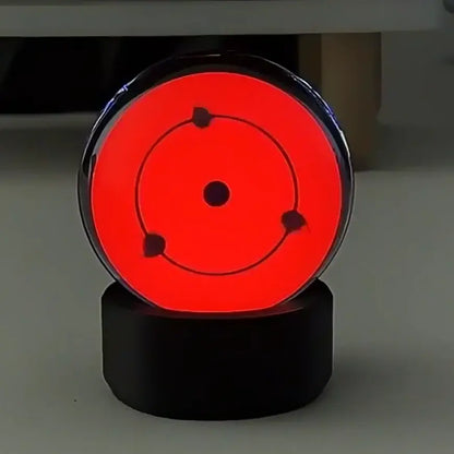 Red glowing three tomoe sharingan led crystal night light with black frame and base for music sync display