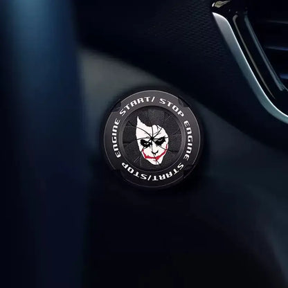 Black circular Naruto Sharingan start button cover with cracked joker face design in white and red for ignition switch decor