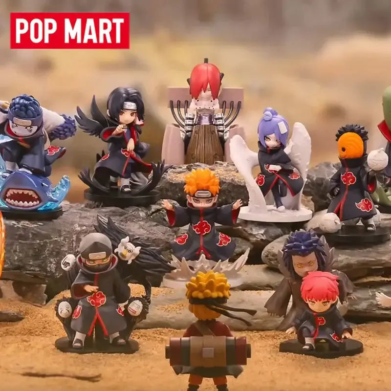 A collection of naruto shippuden akatsuki blind box figures featuring detailed black robes with red clouds and vibrant hair colors