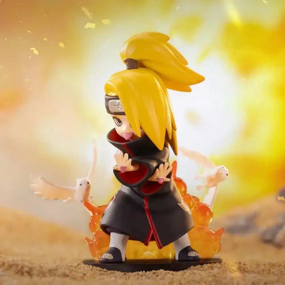 Yellow-haired anime figure in black and red cloak with white birds and orange flames from naruto shippuden blind box