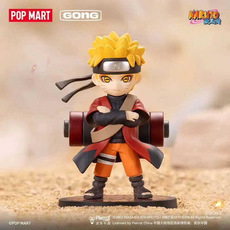 Chibi-style naruto shippuden figurine in orange jumpsuit and red cloak on black base from akatsuki blind box mystery figure