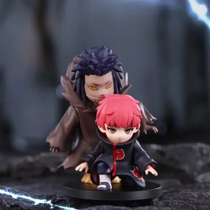 Chibi style naruto shippuden akatsuki blind box figurines in black robes with red clouds featuring purple and pink hair details