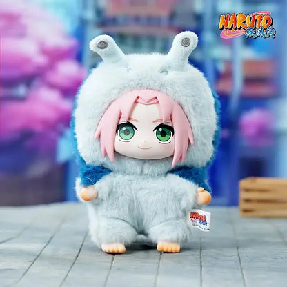 Naruto shippuden blind box stuffed doll with pink hair green eyes wearing fluffy white and blue hooded outfit with antennae