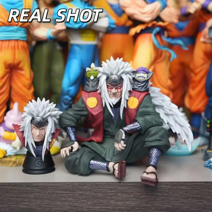 Detailed naruto shippuden jiraiya pvc statue in sitting pose with spiky white hair red vest and green robes for shippuden fans