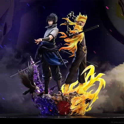 Detailed resin Naruto Shippuden Sasuke pvc statue featuring vibrant orange and black costumes with dynamic chakra effects