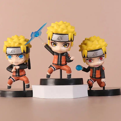 Three chibi naruto figures with spiky blonde hair and orange jumpsuits in an 11cm pvc uchiha itachi figure set