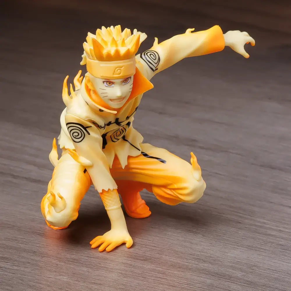Orange and cream naruto uzumaki pvc statue in nine-tails chakra mode with spiky hair and konoha headband for decor