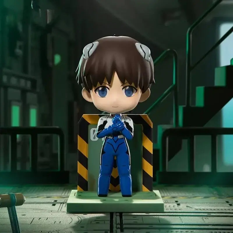 Chibi-style asuka langley soryu figure in blue and white plugsuit with brown hair standing on green base from blind box