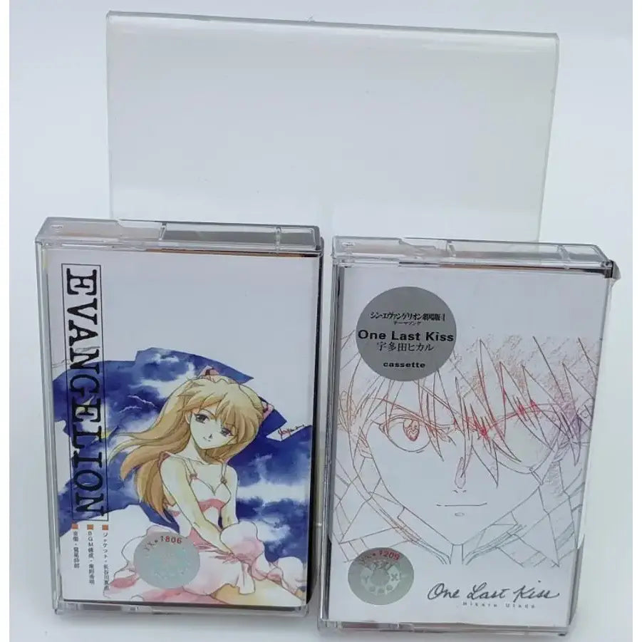 Clear plastic cassette cases featuring asuka langley soryu anime artwork with vibrant colors from one last kiss soundtrack