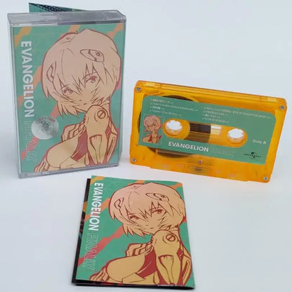 Orange translucent cassette tape with green anime label featuring asuka langley soryu from neon genesis evangelion