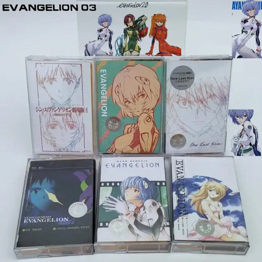 A collection of clear plastic evangelion-themed cassette tapes featuring asuka langley soryu anime artwork