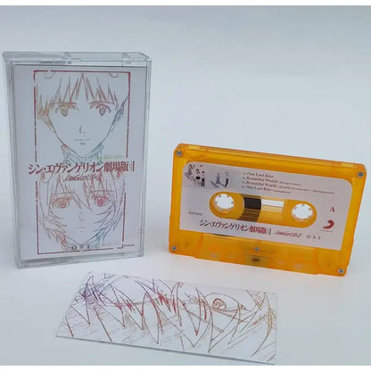 Orange translucent cassette tape with white label featuring anime artwork from neon genesis evangelion asuka langley soryu