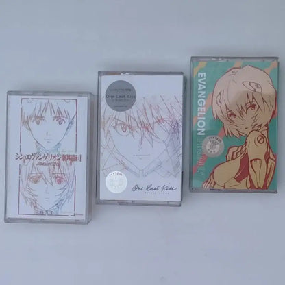 Three anime-themed cassette tapes featuring asuka langley soryu artwork in vibrant color schemes for neon genesis evangelion soundtrack