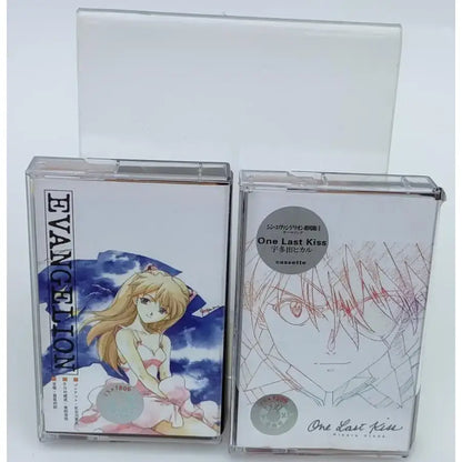 Clear plastic cassette cases with neon genesis evangelion asuka langley anime artwork in pink and blue tones