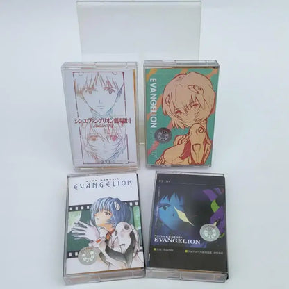 Four clear plastic cassette tapes with distinct neon genesis evangelion asuka langley anime artwork and color schemes