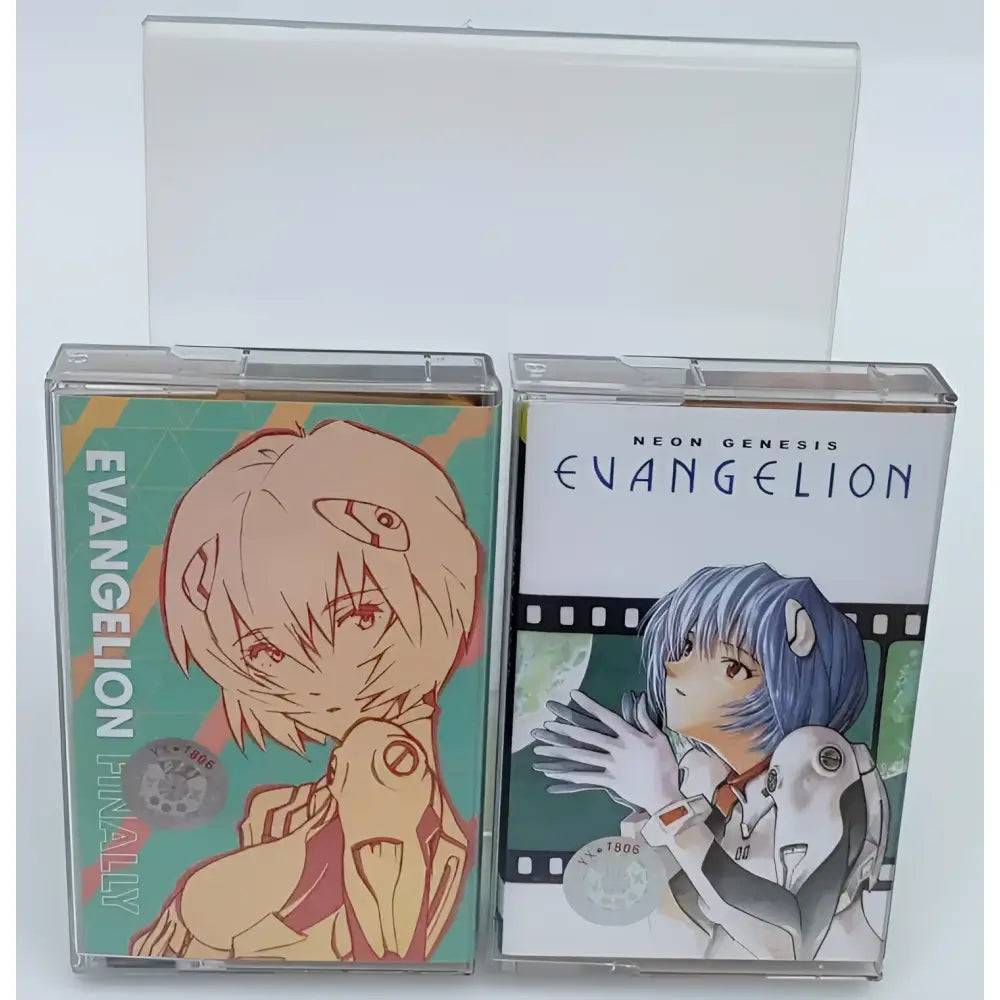 Two clear plastic cassette tapes with neon genesis evangelion asuka artwork featuring teal orange and white green designs