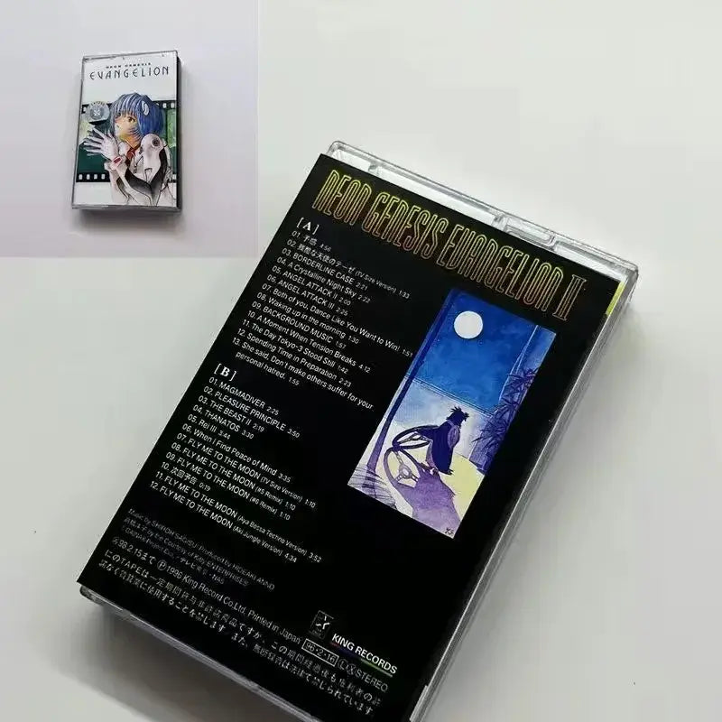 Black cassette tape case with gold lettering and blue anime illustration under moonlit sky neon genesis evangelion soundtrack