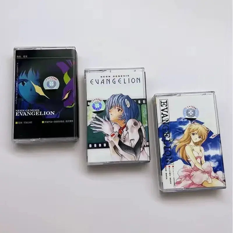 Three clear plastic cassette tapes with neon genesis evangelion artwork featuring vibrant ayanami rei designs