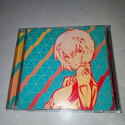 A vibrant neon genesis evangelion ayanami rei cd case with teal orange geometric background and mechanical arm illustration
