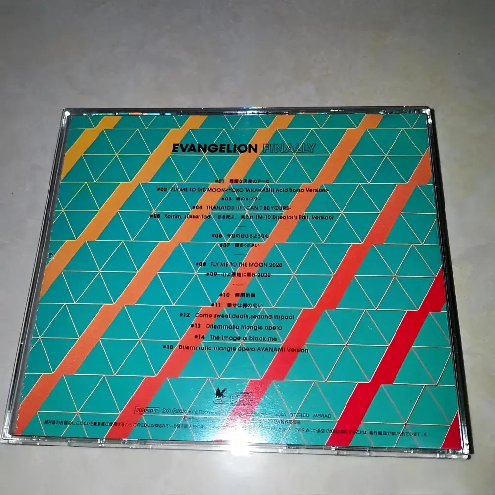 The back cover of the neon genesis evangelion ayanami rei cd features vibrant teal orange and red geometric diagonal stripes
