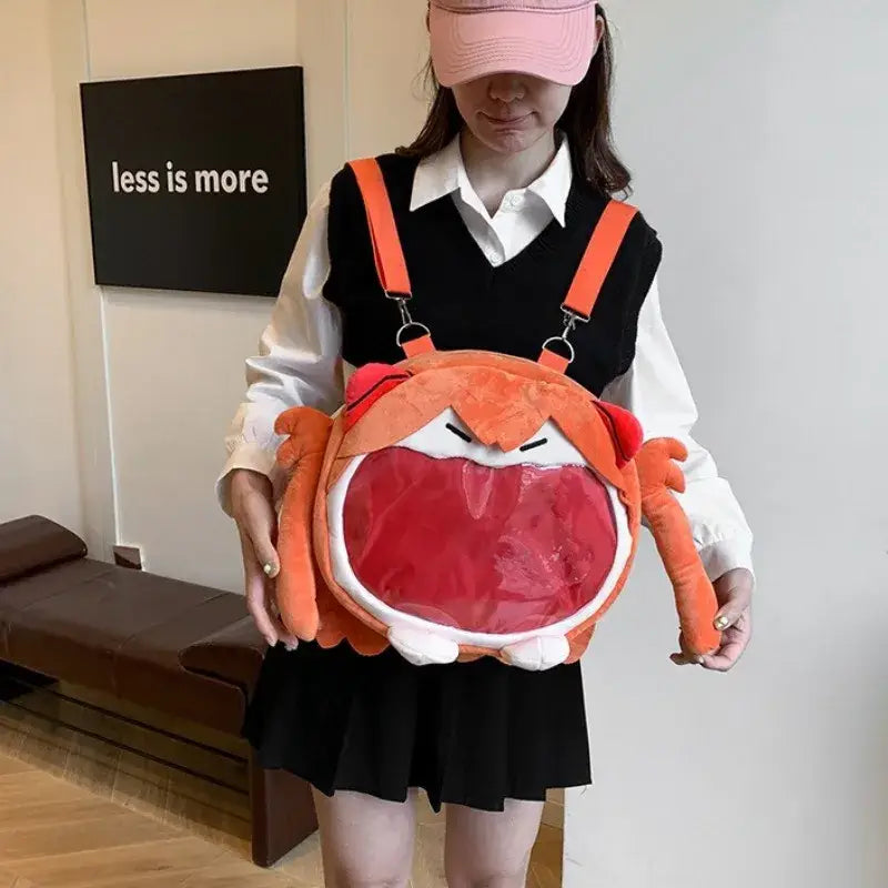 Orange plush crab-shaped backpack with clear red mouth panel white accents for neon genesis evangelion ayanami badge storage