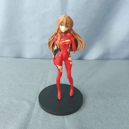 Red plastic pvc figure of ayanami rei in a form-fitting red suit from neon genesis evangelion standing on a base