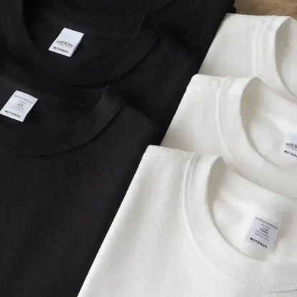 Neatly folded black and white neon genesis evangelion eva unit 01 cotton crew neck t-shirts with minimalist labels