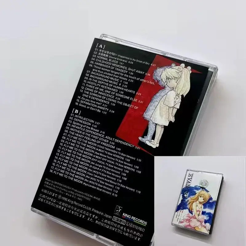 The back cover of the neon genesis evangelion rei cassette tape features a black and red design with a blonde anime girl