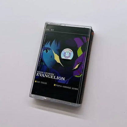 Clear plastic rei cassette tape case with black label featuring blue and purple neon genesis evangelion artwork