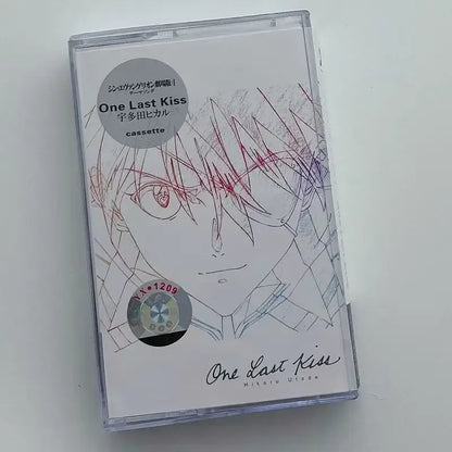 Clear plastic cassette tape case with white label featuring an anime-style character illustration neon genesis evangelion ost