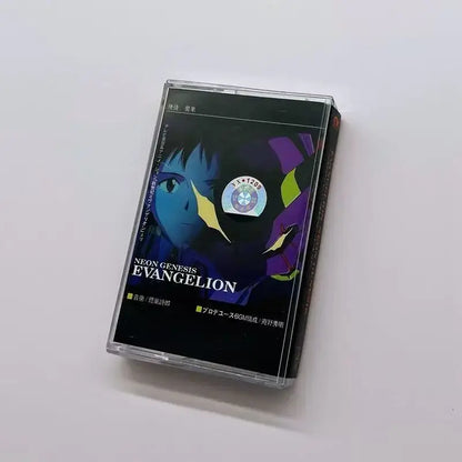 Black cassette tape case with neon genesis evangelion artwork in blue and purple hues encased in clear plastic