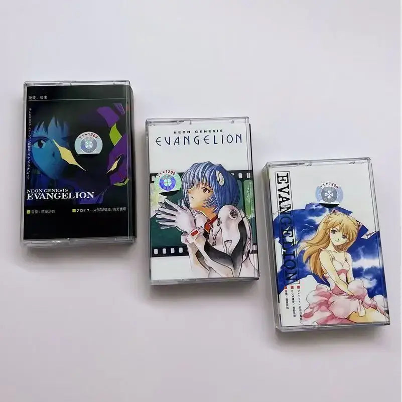 Three clear plastic neon genesis evangelion cassette tapes with anime artwork from evangelion shiro sagisu ost album